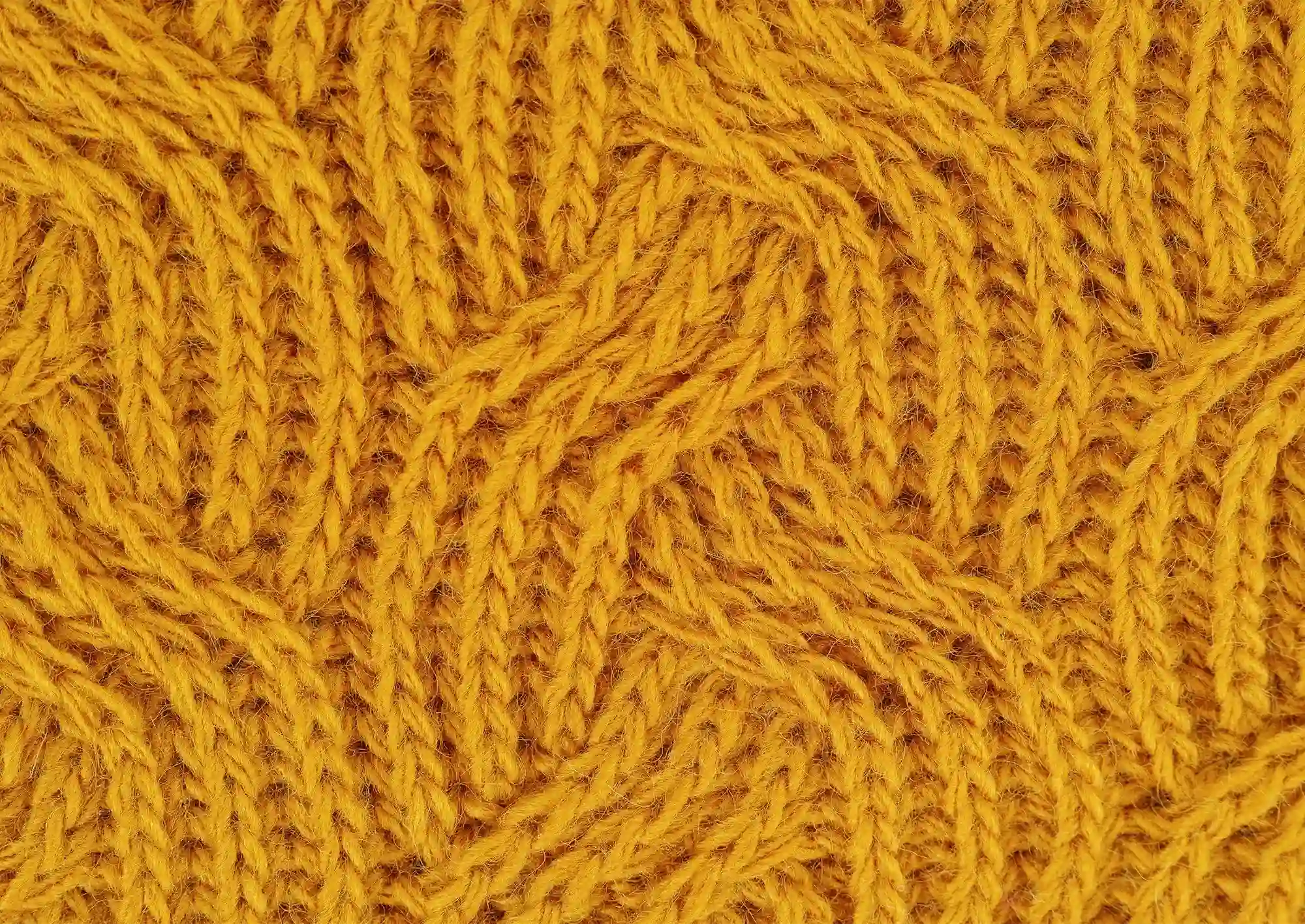 Senapsgul stickning i närbild